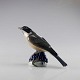 Kgl. porcelæn 
Vindrossel
1235 NNX
1. sortering
Højde: 14 cm
Bredde: 17,5 
cm 
Dybde: 7 ...