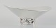 Henning Koppel for Georg Jensen, colossal sterling silver bowl on three-legged foot.Designed ...