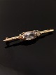 14 karat guld 
broche 5,2 cm. 
med klar sten 
flot stand emne 
nr.  519305