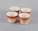 Wilhelm Kåge 
for 
Gustavsberg. 
Four flower pot 
covers in 
porcelain. 
Swedish design, 
...