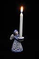 L. Hjorth ceramic angel in blue / white glaze holding a small candle. 
Height: 9,5cm.