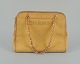 Chanel 
kalveskinds-
taske i gult 
italiensk 
kalveskind. 
1970/80’erne.
Made in Italy.
Dustpose ...