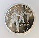 Nord Korea. 
Olympiaden 
2004. Sølvmønt 
7 Won  fra 
2002. Diameter 
38 mm.