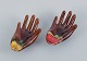 Vallauris, 
France, a pair 
of ceramic 
bowls shaped 
like hands in 
brightly 
colored ...