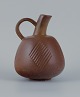 Nils Thorsson 
(1898-1975) for 
Royal 
Copenhagen, 
stoneware jug 
with brownish 
...
