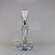 Bordlampe i 
transparent 
glas
Model Astoria
Producent 
Holmegaard
Højde 32 cm
Diameter 14,5 
cm