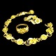 Georg Jensen; Smykkesæt i 18 kt. guld bestående af armbånd, broche og ring. Armbånd l. 18,2 cm ...