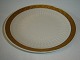 Kongelig Guld 
Vifte, 
Middagstallerken.

 
Dek.nr. 414 / 
11519
 
1. sortering.
 
Diameter ...