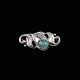 Evald Nielsen 
1879 - 1958. 
Skønvirke 
Broche i 
sterlingsølv 
med amazonit.
Tegnet og 
udført hos ...