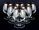 Murano, Italy, 
six mouth-blown 
and engraved 
brandy glasses 
with silver 
rim.
Mid 20th ...
