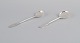 Evald Nielsen, 
Danish 
silversmith, 
two hammered 
sugar spoons in 
Danish 830 
silver. One 
spoon ...