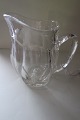 Antik 
Flødekande 
Chippendale 
Presset glas 
Kastrup 
Glasværk
H: ca 10cm
God stand
Lager: 1 ...