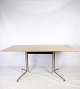 Spinal spisebord, designet af Paul Leroy med bordplade af egetræ og stel af mat forkromet stål ...