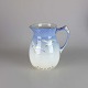 Kande fra 
stellet 
Mågestel med 
guldkant no 85
Producent Bing 
& Grøndahl
Porcelænskande 
i ...