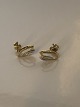 Earrings in 14 
carat gold and 
white gold
Stamped 585
Height 13.40 
mm
Width 8.65 mm 
...
