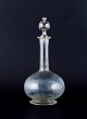 Dansk glasværk, mundblæst vinkaraffel i klart glas. Ca. 1900.I flot stand.Mål: H 27,5 x D ...