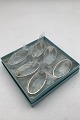 W & S Sørensen 
Sølv 
Dobbeltriflet 
Servietring Sæt 
(6)  Måler 5.4 
cm x 2.8 cm 
(2.12 inch x 
1.10 ...
