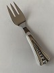 Serving fork in 
silver
Stamped 3 
towers HFH
Length approx. 
12 cm
Produced in 
the year ...