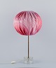 Josef Frank (1885–1967), large table lamp in glass and brass. Textile lampshade 
with pink tones and floral motifs.