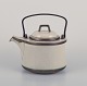 Bing & 
Grøndahl, 
"Tema". 
Stoneware 
teapot. Cast 
iron handle.