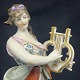 Højde 15 cm.
Flot håndmalet 
figur fra 1800 
tallets 
slutning 
forestillende 
kvinde med 
lyre, en ...