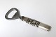 Georg Jensen. 
Scroll. Bottle 
opener. Silver 
(925). Length 
11 cm