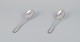 Georg Jensen. 
To Kugle 
spiseskeer i 
tretårnet sølv.