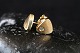 Stud earrings in 14 carat gold, with inlaid clear stone.