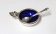 Georg Jensen. 
Akorn, salt 
cellar with 
blue enamel, 
and salt spoon. 
Sterling (925).