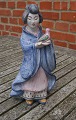 Hjorth Danish stoneware figurine No 531 in blue 
glaze. Japanese woman carries a bird and the left 

foot is glued.