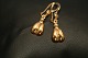 14 karat guld øreringe med runde former
