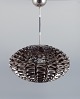 Britt Kornum 
for Normann 
Copenhagen. 
Loftslampe af 
rustfrit stål. 
Model Norm 03. 

Tidligt 21. 
...