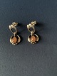 Georg Jensen, 
2006 Års 
Ørestikker 
sterlingsølv 
med orange 
månesten.
Stemplet; 
2006, Georg ...