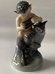 Smuk lille 
figur, der 
forestiller 
Faun med ugle. 
Figuren er fra 
Royal 
Copenhagen, 1. 
sortering ...