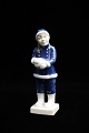 Royal 
Copenhagen 
porcelænsfigur 
af pige med 
snebold.
Dekorationsnummer: 
5656. 1.sort. 
Højde: ...