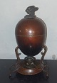 Antique copper 
egg stand