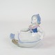 Figur af 
porcelæn med 
motiv af 
siddende pige i 
uniform, som 
kan benyttes 
som lille skål 
nr. ...