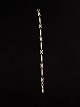 14 karat guld 
armlænke 17,5 
cm. B. 0,6 cm. 
emne nr.555637