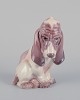 Dahl Jensen. 
Porcelænsfigur 
af siddende 
Basset.
Model: 1065.
1930’erne.
Perfekt ...