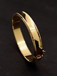 14 karat guld 
armring 
indvendig 6,2 x 
5,5 cm. b. 1,1 
cm. vægt 21 
gram fra 
guldsmed Fl. 
Lund ...