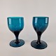 Vinglas af 
mundblæst 
tyrkis farvet 
glas.
2 styk haves
Højde 11,5 cm
Diameter 7 cm