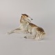 Figur af 
porcelæn, 
formet som en 
Borzoi (russisk 
mynde) i hvide, 
brune og gyldne 
...