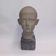 Young man bust in stone