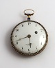 Nolls. Gold pocket watch with enamel back (750). Movement number 1393. Diameter 
50 mm. Minor defects on the enamel. Minor holes in the side. Clockwork does not 
work.