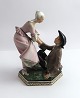 Bing & 
Grøndahl. 
Dansende par 
falder. Figur 
8041. Design 
:Tegner. Højde 
14 cm. (1 
sortering)