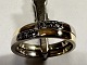 14k Guld ring , 
2 ringe loddet 
fast sammen , & 
6 stk. 
diamanter 0,02 
ct.
ialt 0,12 ct. 
w/vs . ...