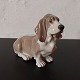 Figur af basset 
hund i porcelæn 
fra Royal 
Copenhagen. 
Designet af 
Jeanne Grut. 
Fremstår i god 
...