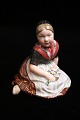 Royal 
Copenhagen 
porcelæns figur 
af " Fanø pigen 
" i overglasur.
Dekorationsnummer 
: 12416. ...