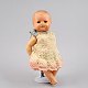 Doll in 
porcelain.