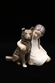 Sjælden 
porcelænsfigur 
fra Bing & 
Grøndahl af 
pige med hund.
Dekorationsnummer 
: 1973. 1.sort. 
...